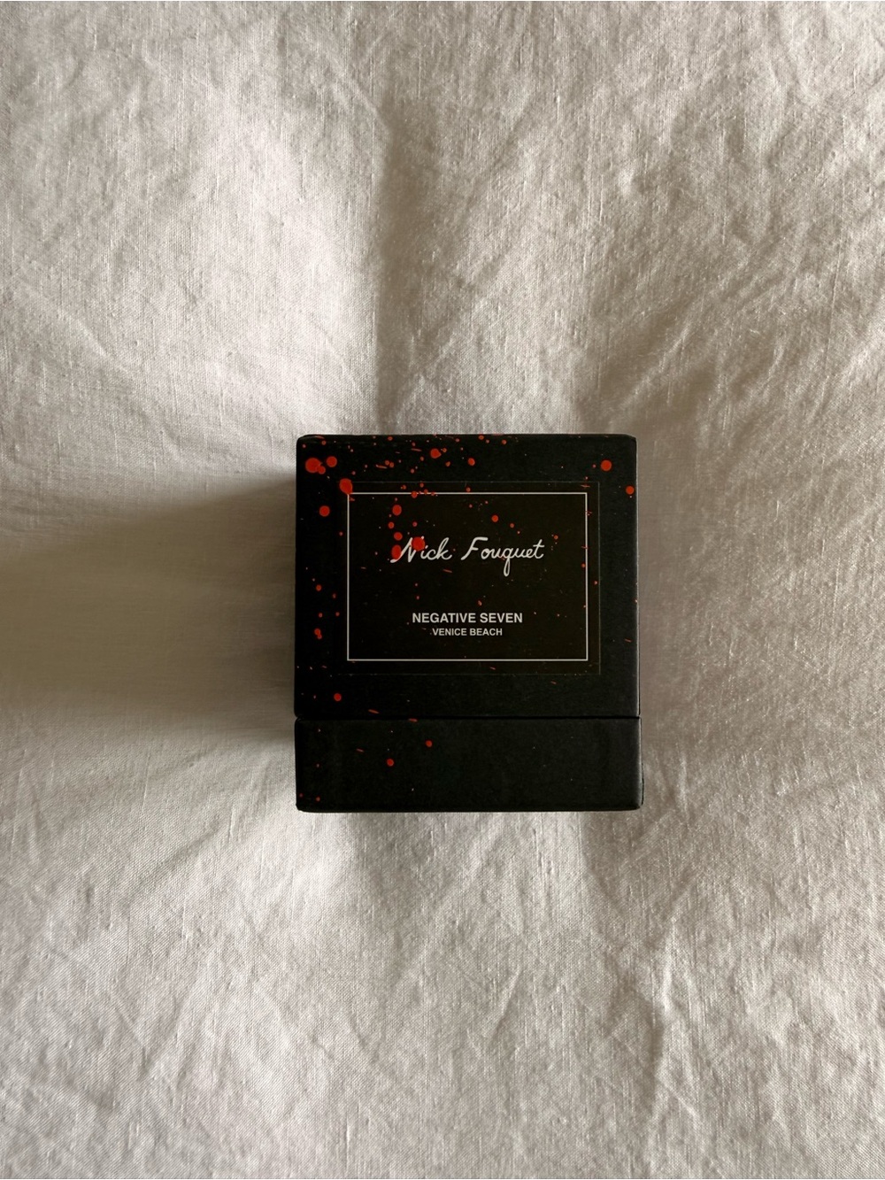Nick Fouquet black box with red splatter accents
